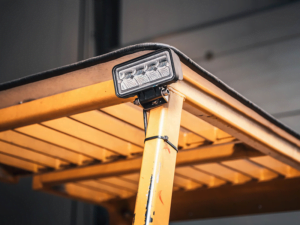 Mini LED work light mounted on a forklift